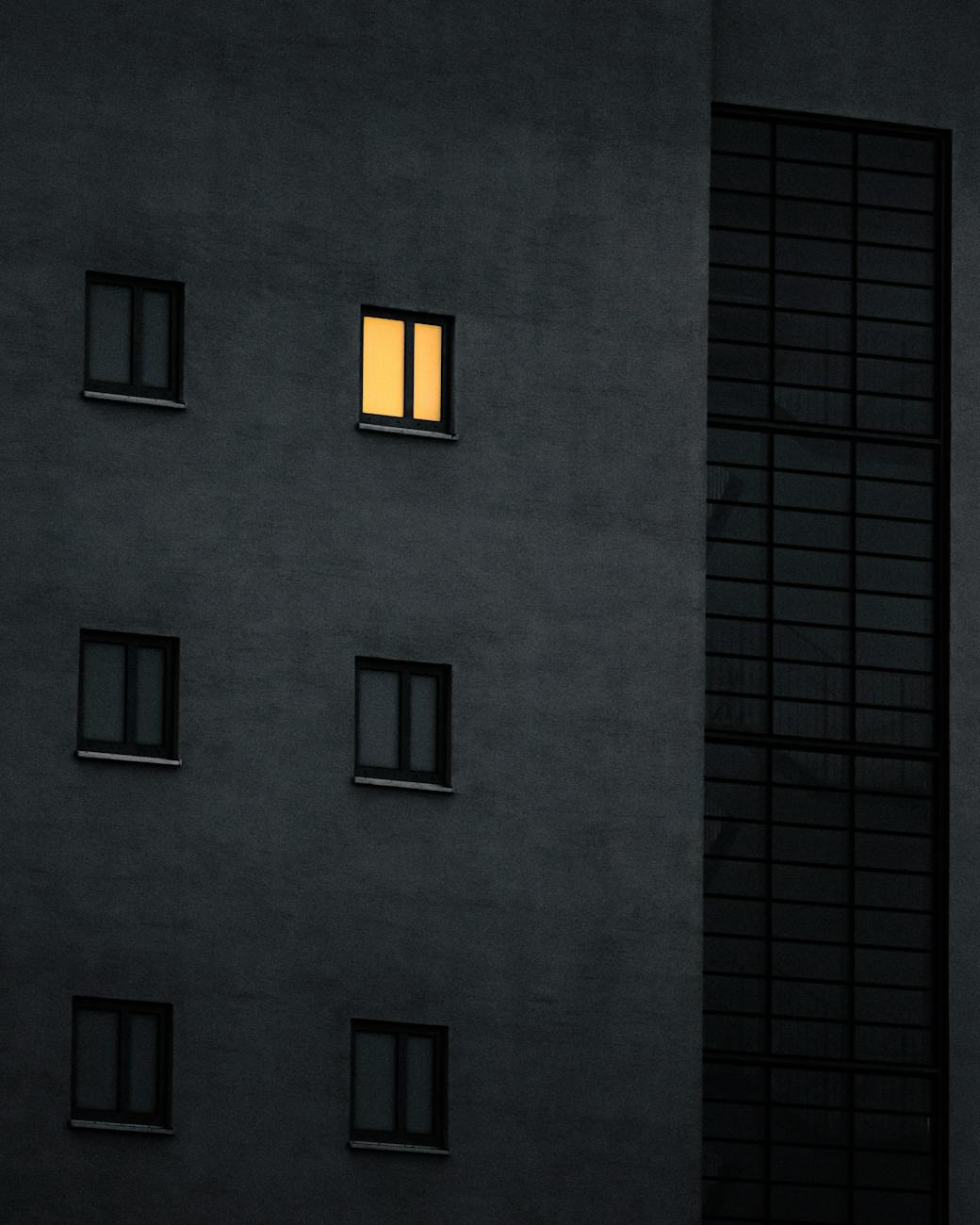 light in one window in block of flats