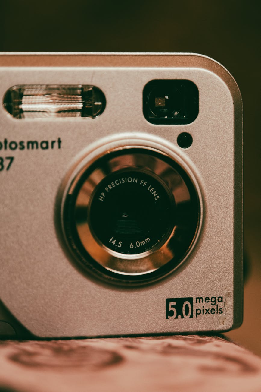 a silver camera with a small lens on it