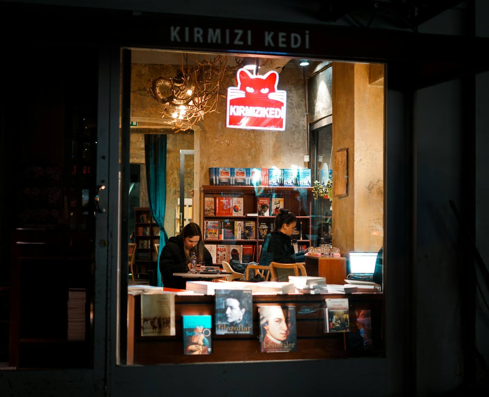 cozy nighttime bookstore in warm lighting
